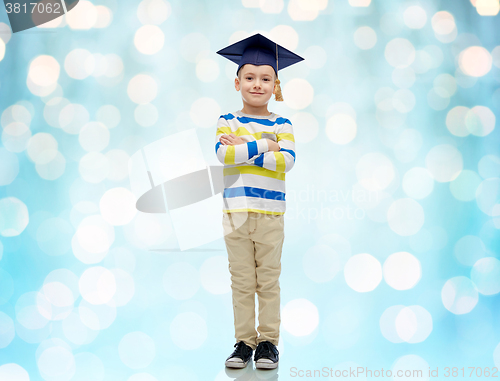 Image of happy boy in bachelor hat or mortarboard