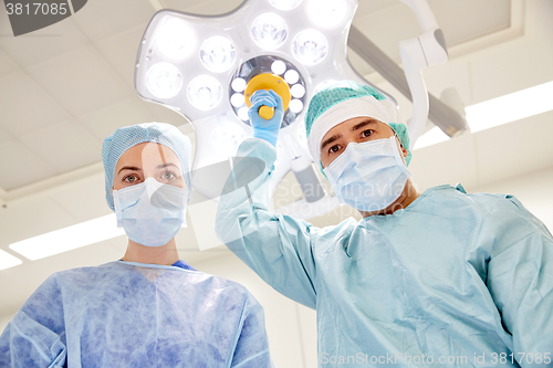 Image of group of surgeons in operating room at hospital