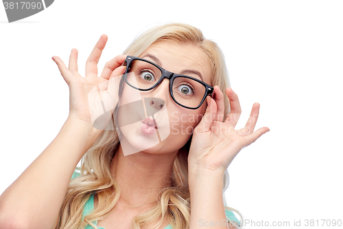 Image of happy young woman in glasses making fish face