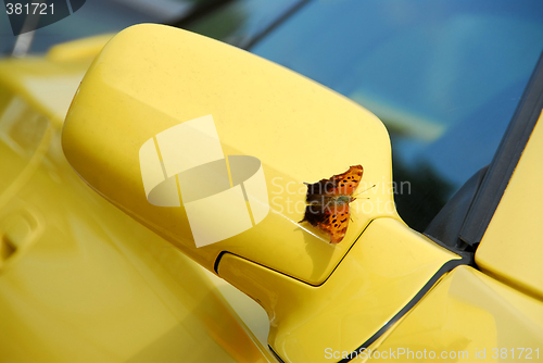 Image of Mirror of yellow sports car