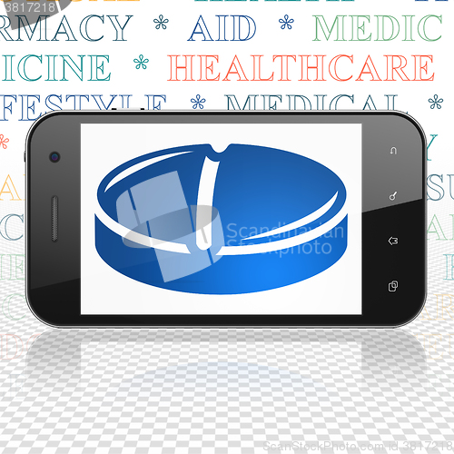 Image of Healthcare concept: Smartphone with Pill on display