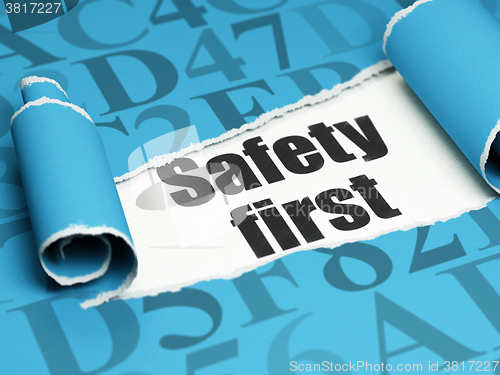 Image of Safety concept: black text Safety First under the piece of  torn paper