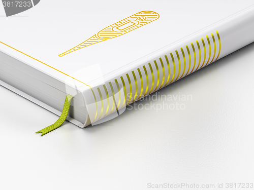 Image of Healthcare concept: closed book, Thermometer on white background