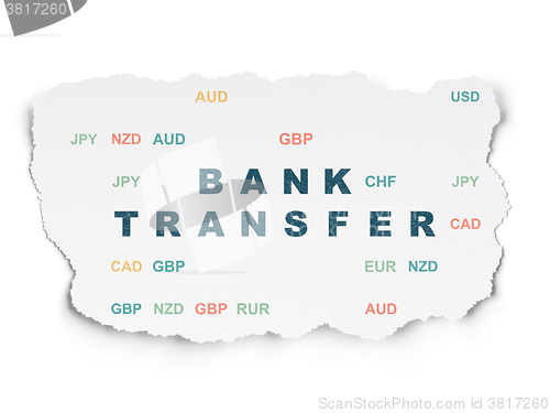 Image of Currency concept: Bank Transfer on Torn Paper background