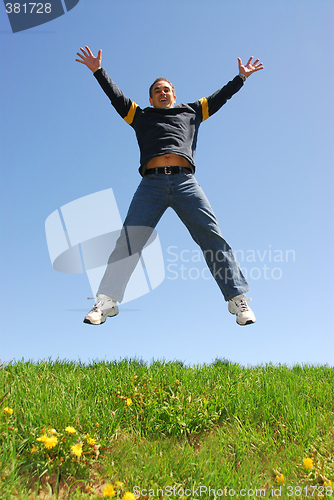 Image of Man jumping happy