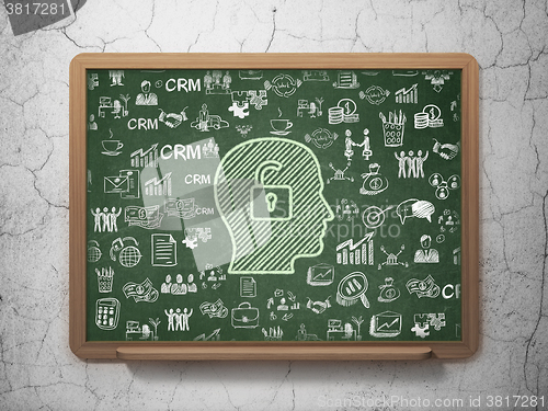 Image of Business concept: Head With Padlock on School Board background