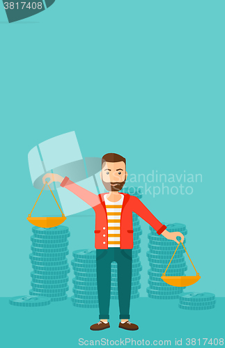 Image of Businessman with scales.