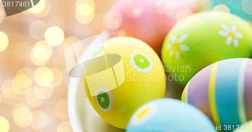 Image of close up of colored easter eggs on plate