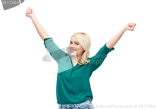 Image of smiling young woman in shirt and jeans