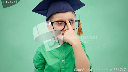 Image of happy boy in bachelor hat and eyeglasses