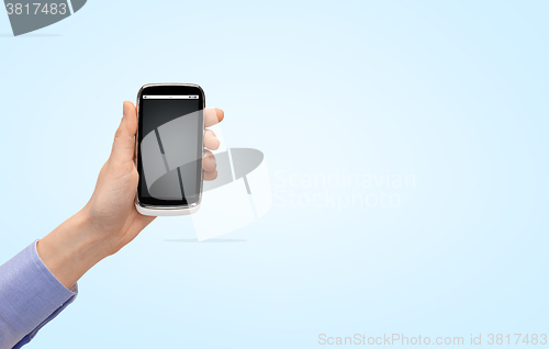 Image of close up of woman hand with smartphone