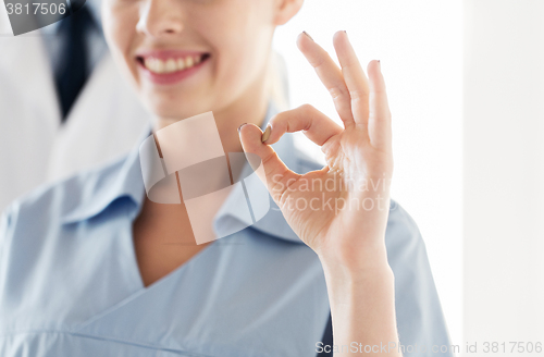 Image of close up of doctor or nurse showing ok sign