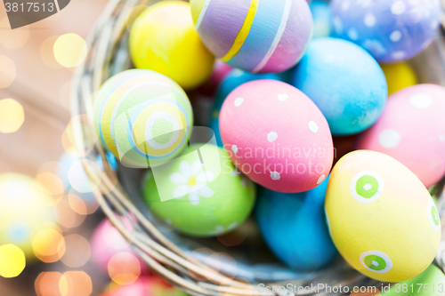 Image of close up of colored easter eggs in basket