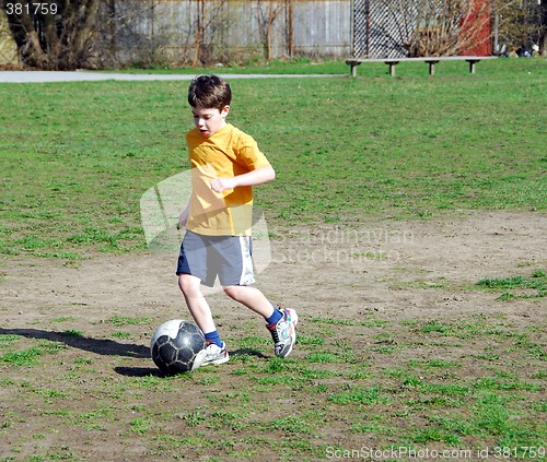 Image of Boy playing soccer