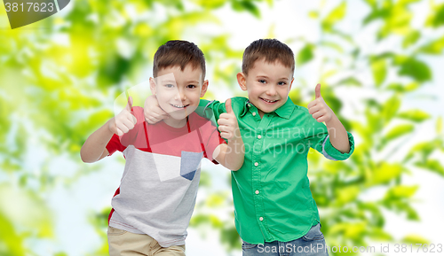 Image of happy smiling little boys showing thumbs up