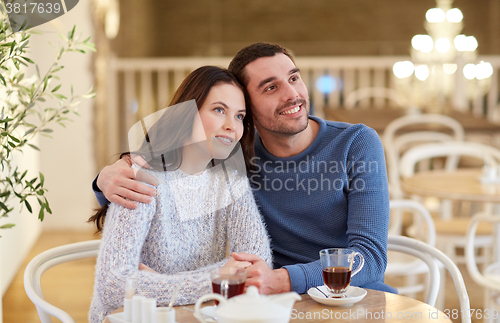 Image of happy couple drinking tea at restaurant