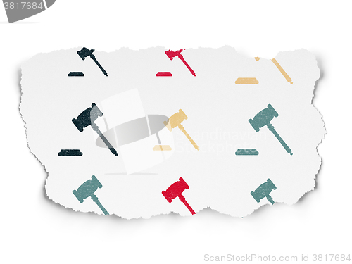 Image of Law concept: Gavel icons on Torn Paper background