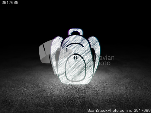 Image of Tourism concept: Backpack in grunge dark room