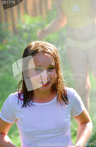 Image of Girl and sprinkler