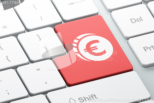 Image of Banking concept: Euro Coin on computer keyboard background