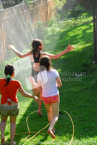 Image of Girls run sprinkler