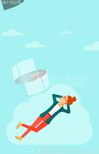 Image of Business woman relaxing on cloud.