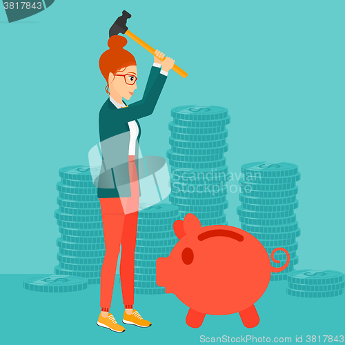 Image of Woman breaking piggy bank.