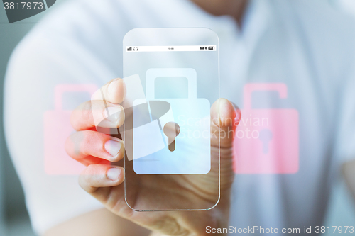 Image of close up of hand with security lock on smartphone