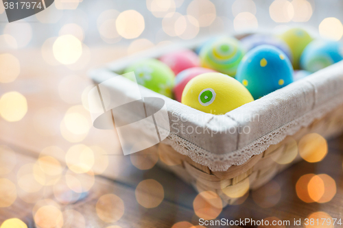 Image of close up of colored easter eggs in basket