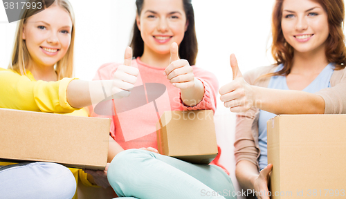 Image of close up of teenage girls with cardboard box