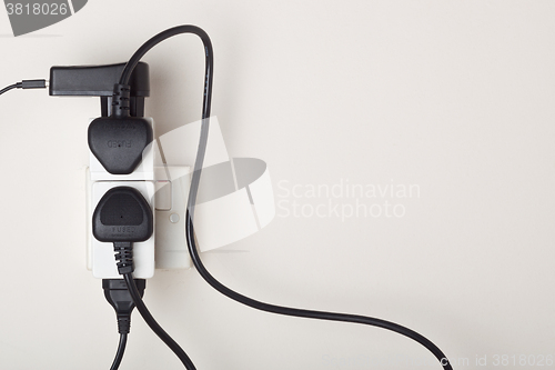 Image of Overloaded ac power wall socket