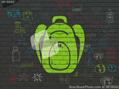 Image of Tourism concept: Backpack on wall background