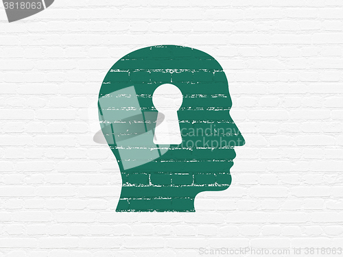 Image of Data concept: Head With Keyhole on wall background