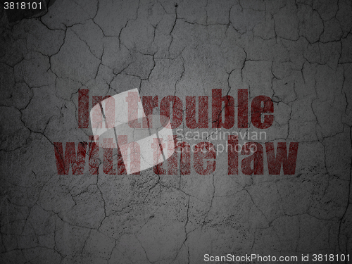 Image of Law concept: In trouble With The law on grunge wall background
