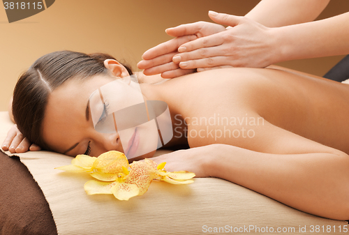 Image of beautiful woman in massage salon