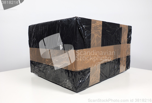 Image of Black packet parcel