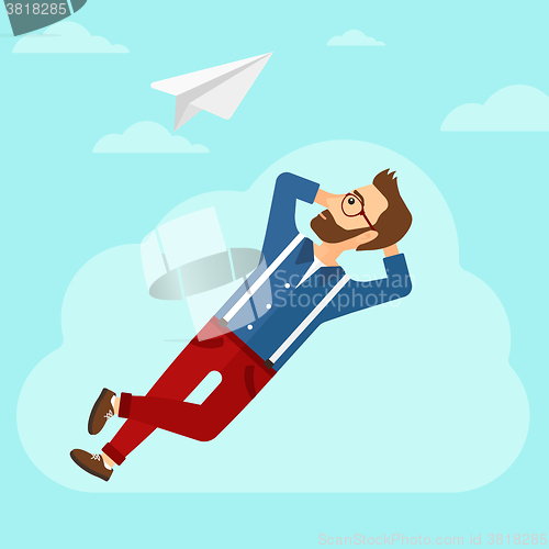 Image of Businessman relaxing on cloud.