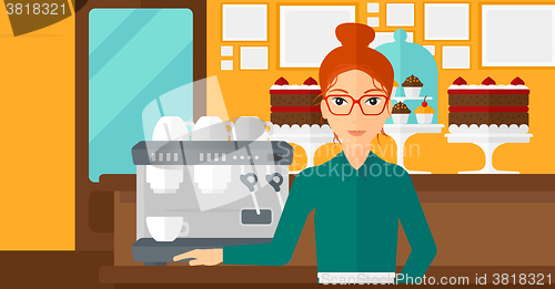 Image of Barista standing near coffee maker.