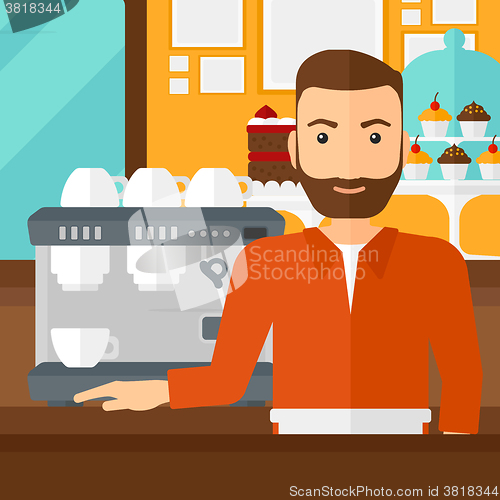 Image of Barista standing near coffee maker.