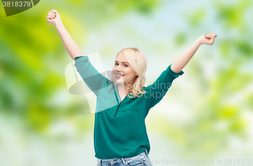 Image of smiling young woman in shirt and jeans