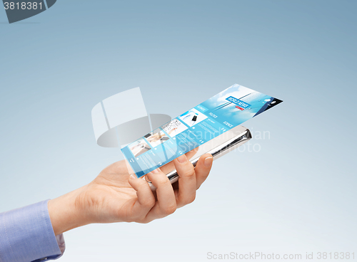 Image of close up of hand with smartphone and news web page