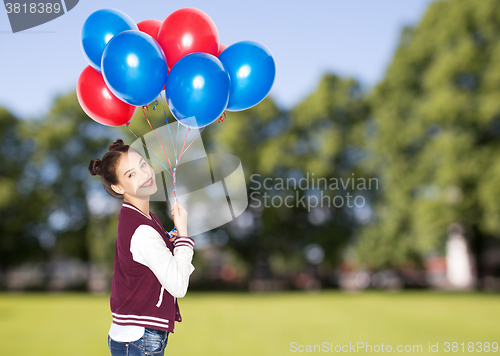 Image of happy teenage girl with helium balloons