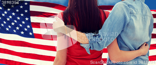 Image of close up of women couple over american flag