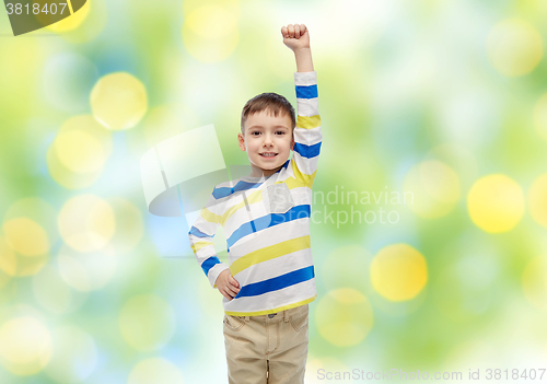 Image of happy smiling little boy with raised hand