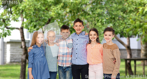 Image of happy smiling children hugging over backyard