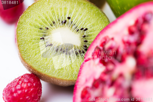 Image of close up of ripe kiwi and other fruits