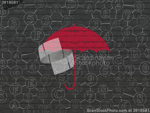 Image of Safety concept: Umbrella on wall background