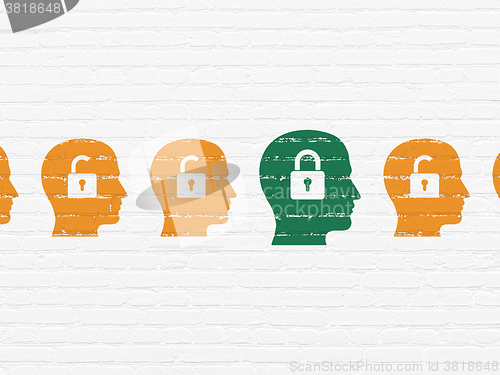Image of Business concept: head with padlock icon on wall background