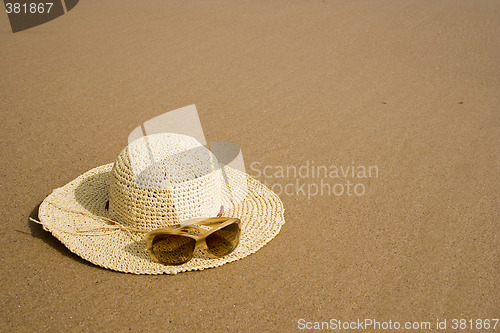 Image of sunglass and summer hat