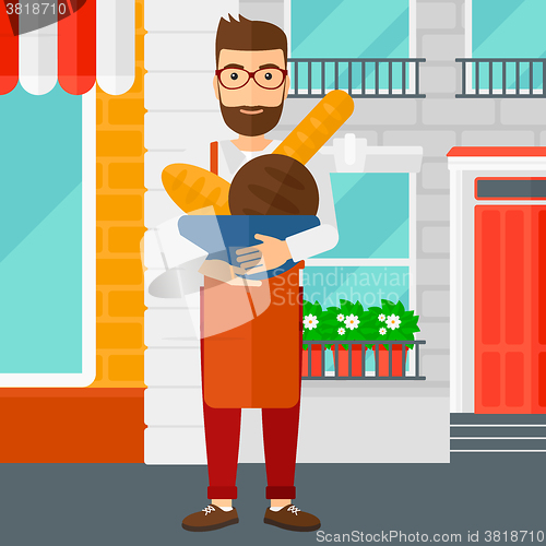 Image of Bakery owner with bread.